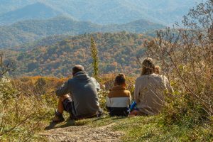 family enjoying fall color in nc smoky mountains